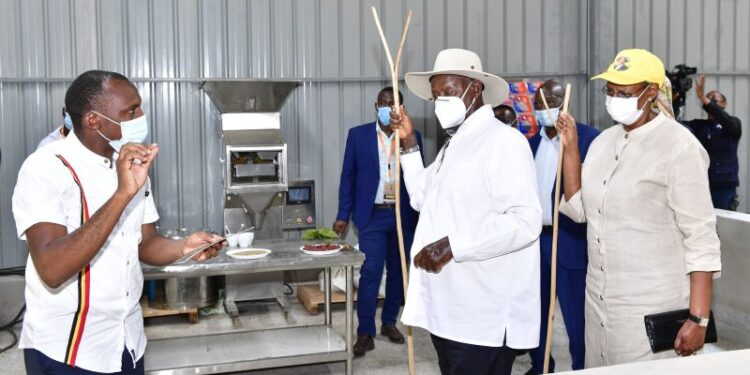 Tugume Nelson with Museveni
